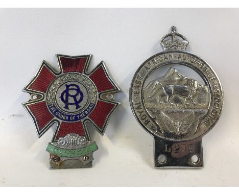 A Royal East African Automobile Association badge no. L235 and an Order of The Road, Commander part enamel badge no. G2689.