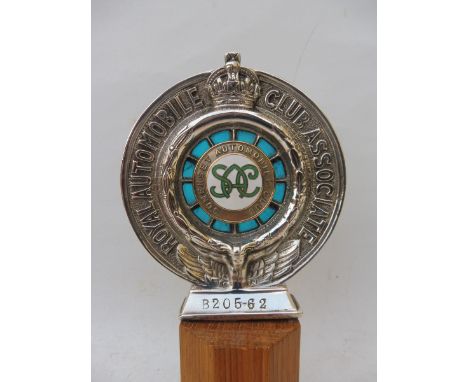 A Royal Automobile Club Associate car badge with Somerset Automobile Club enamel centre stamped B20562, display base mounted.