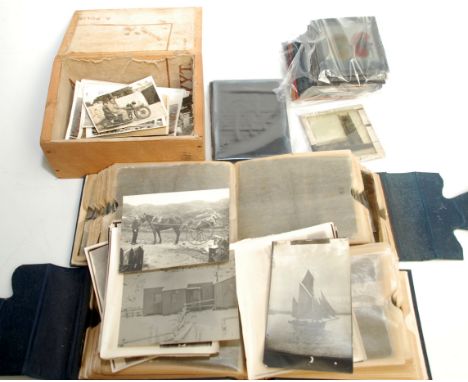 A selection of photos, glass slides and negatives, including vintage motoring.