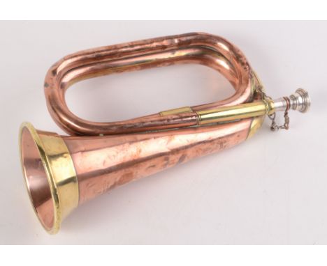 A WWI copper and brass bugle with silver plated mouthpiece by Hawkes & Son Makers, Denman Street, Piccadilly Circus, London W