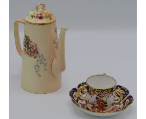 A Royal Worcester blush ivory coffee pot, with floral decoration, height 19cm, Royal Crown Derby tyg and saucer dish.    Cond