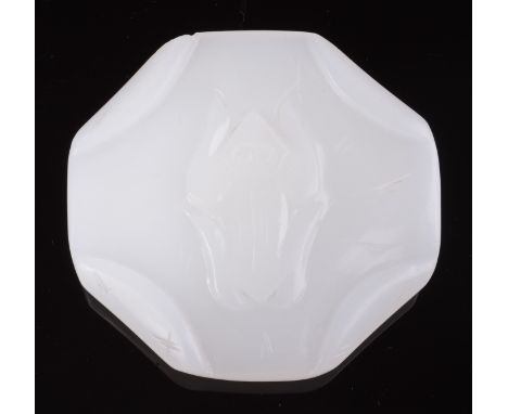 A Chinese white jade, circular pebble shaped toggle carved as a lotus leaf with folded corners and veins upon which squats a 