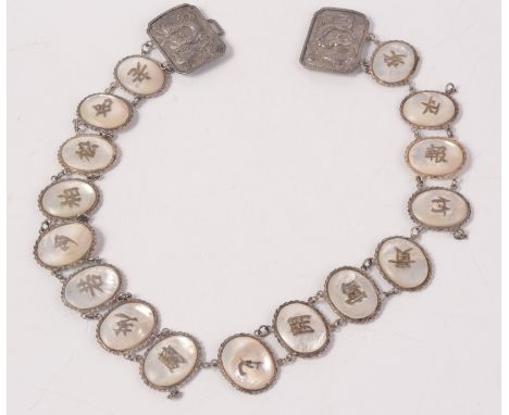 A Chinese silver and mother of pearl belt.