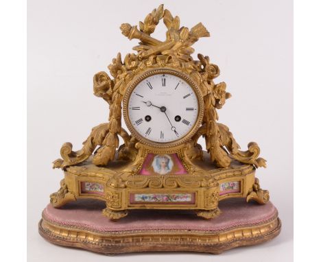 A French porcelain mounted ormolu mantel clock, 19th century, the white enamel dial inscribed 'Grohe, 7 Wigmoore Street' and 