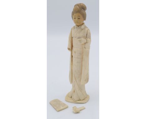 A Japanese bone and vegetable ivory figure of a geisha girl, height 15cm.