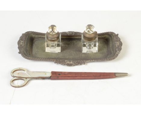 A pair of early 20th century scissors with mother of pearl handles and a matching letter knife in a red leather sheath, toget