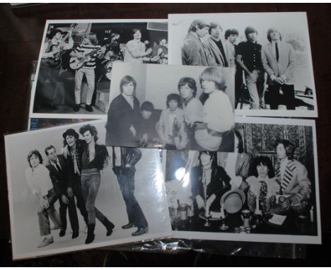 The Rolling Stones, a collection of mostly black and white photographs of the band etc.