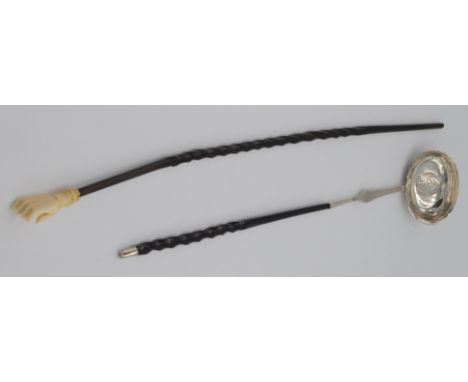 A Georgian silver punch ladle, set with a coin dated 1787, with spiral baleen handle, length 38.5cm and an ivory hand back sc