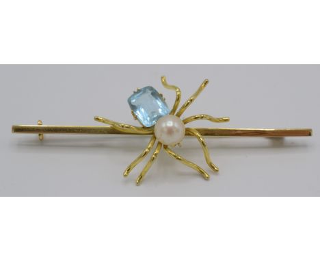 A 9ct gold spider bar brooch set a cultured pearl and blue stone.