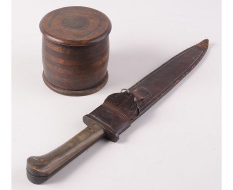 A wooden handled dagger with steel blade in a leather scabbard, length 46cm, together with a circular, lidded wooden box, dia