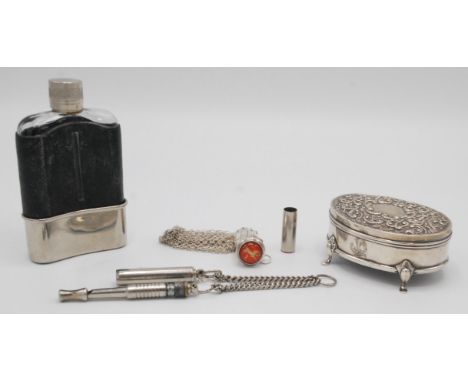 An Edwardian silver oval embossed trinket box, Birmingham, 1905, silver plated hip flask and two other items. 