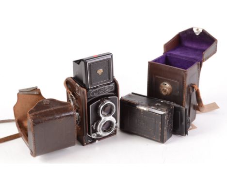 A Minolta Autocord twin lens reflex camera and leather case, height 14cm and a Zeiss Ikon Compur folding camera 107/1.