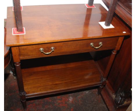 A walnut serving table with single drawer on fluted supports with low shelf, width 86cm.