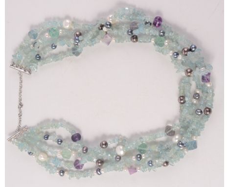 A multi strand aquamarine, amethyst and fresh water pearl necklace.