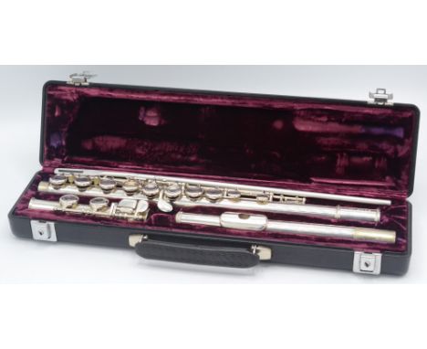 A flute in a fitted velvet case, inscribed 'Buffet Crampon Paris, cooper scale, ARC E', No. 228. 