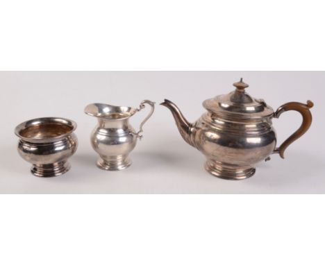 A George V three piece silver tea service, London 1922 and 1923. 29oz. 