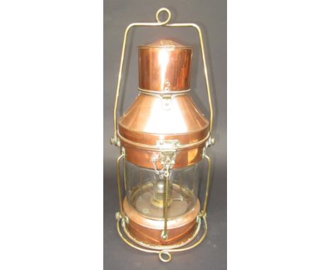 A copper ship's lamp with burner, height 52cm. 
