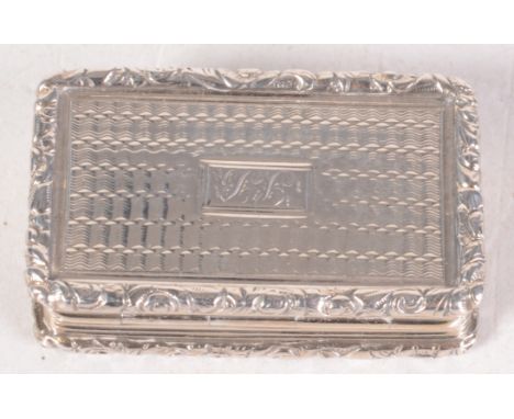 A William IV silver vinaigrette by Thomas Shaw, engine turned and with chased borders, Birmingham 1832. 3.7cm.