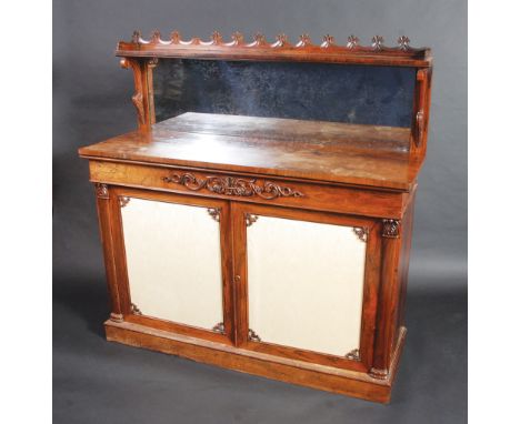 A good Regency rosewood veneered chiffonier, the back mirrored beneath an open shelf with wave gallery, the trees with a pair