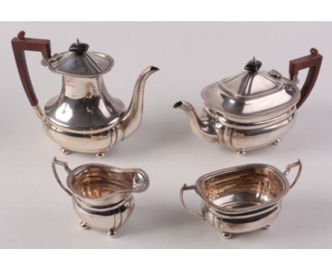 An Elkington post war, four piece silver tea and coffee service of oval section with gadrooned borders. 52.5oz.