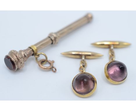 A pair of amethyst cufflinks set in gold, together with a gold propelling pencil with an 'amber' finial. 