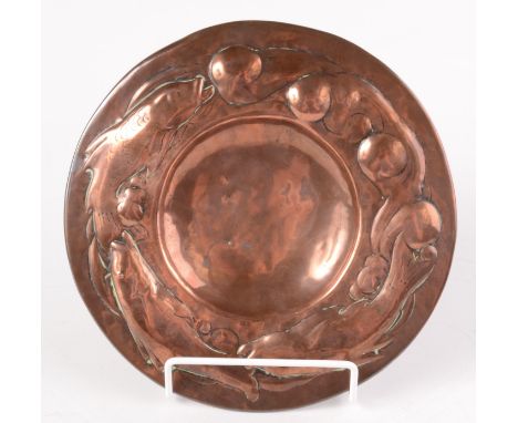 A Newlyn Industrial Class copper dish  by Philip Hodder. The broad rim with an arc of three fish swimming amongst seaweed. In