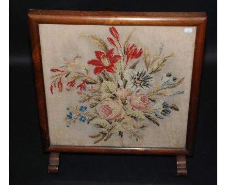 A woolwork firescreen.