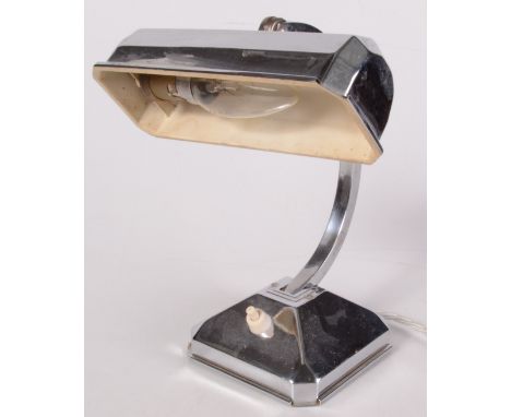 An Art Deco style chrome desk lamp, height 24cm.     Condition report:  Lamp loose, some wear to chrome, small dent next to s