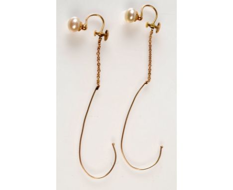 A pair of gold and pearl screw on earrings with gold safety hooks.