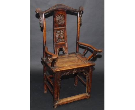 A Chinese hardwood provincial armchair, 18th/19th century, the shaped scroll carved top rail above a pierced splat decorated 