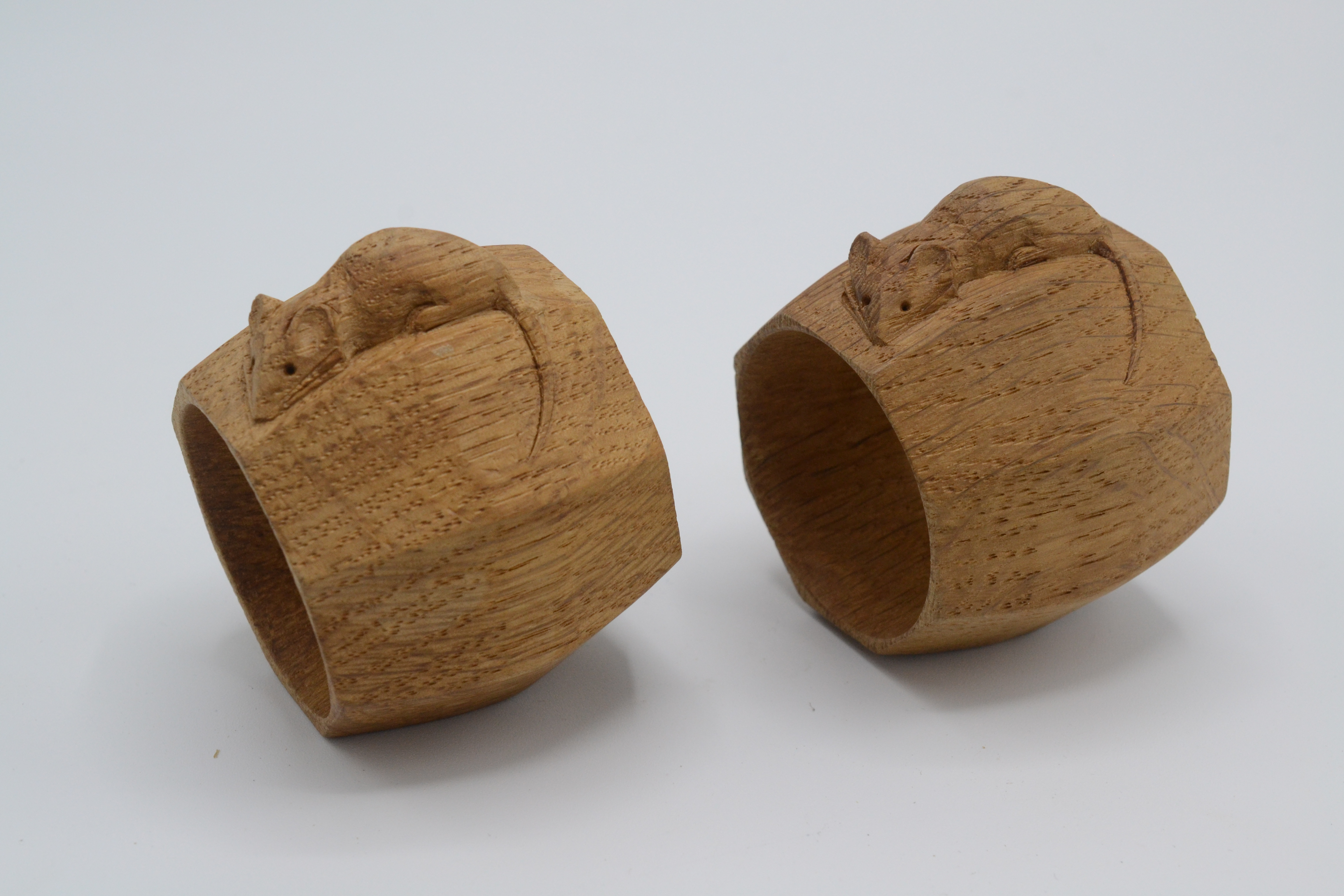 Two oak Mouseman napkin rings, by Robert Thompson of Kilburn, diameter 5cm.