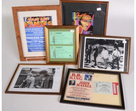 Framed photographs of the Rolling Stones and Jimi Hendrix, together with four framed concert tickets.