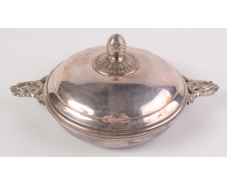 A Christophle oval serving dish with twin leaf moulded handles and artichoke cast finial.