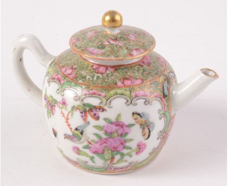 A Chinese Canton porcelain teapot, 19th century, decorated with an interior scene with figures, the opposite panel filled wit