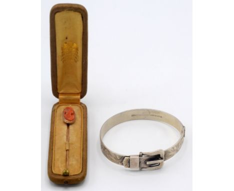 A cased gold stick pin with cameo finial, together with a silver belt bangle. 