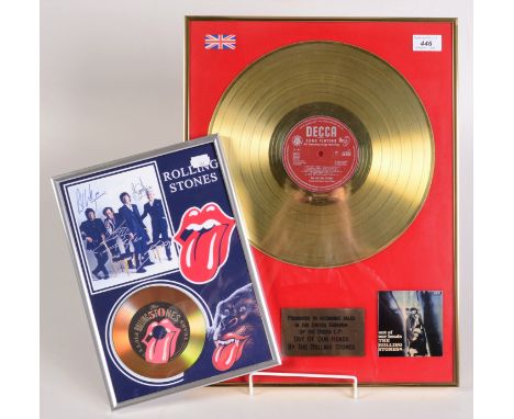 The Rolling Stones, an Out of Our Heads gold disc and a Fifty Years 7" disc.