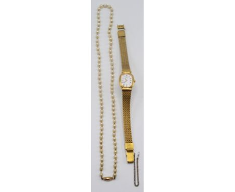 A cultured pearl necklace with gold clasp and a ladies watch. 
