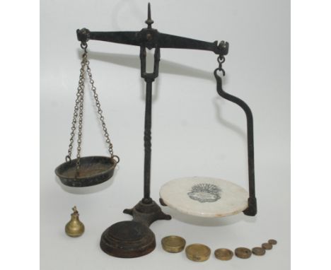 A set of Henry Pooley & Son Ltd cast iron scales, width 49cm, height 46cm, together with eight various brass weights.