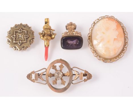 A cameo brooch, a late Georgian miniature rattle with coral teether and three other pieces. 