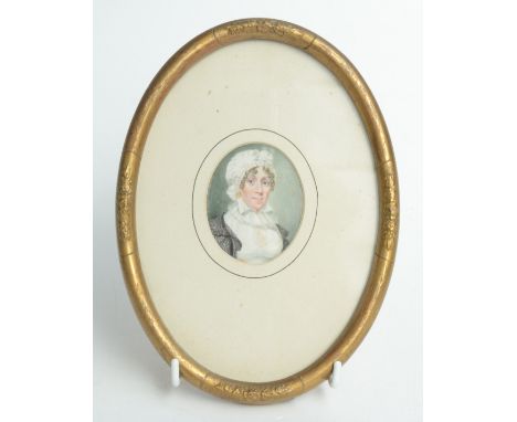 A 19th century miniature portrait of a lady wearing a mop cap.