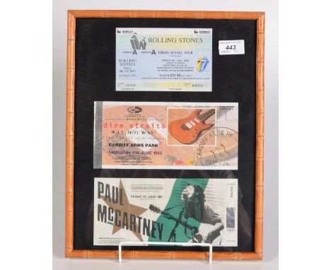 The Rolling Stones, an Urban Jungle Tour ticket, a Paul McCartney 1991 St Austell ticket and one other, framed as one.