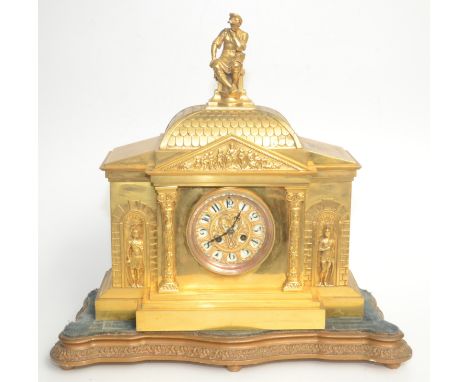 A large French 19th century gilt metal mantel clock, the circular enamel dial flanked by pillars and soldiers, on a giltwood 