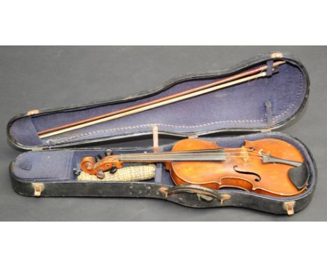 A violin labelled 'Copy of Antonius Stradivarius' cased with a bow, length of back 36cm.