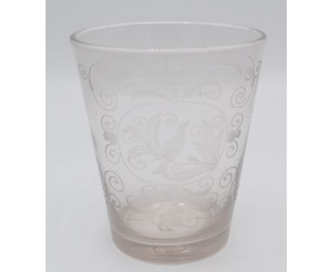 A 18th/19th century glass tumbler, the central panel decorated with a bird perched on a branch amongst scrolling vines, heigh