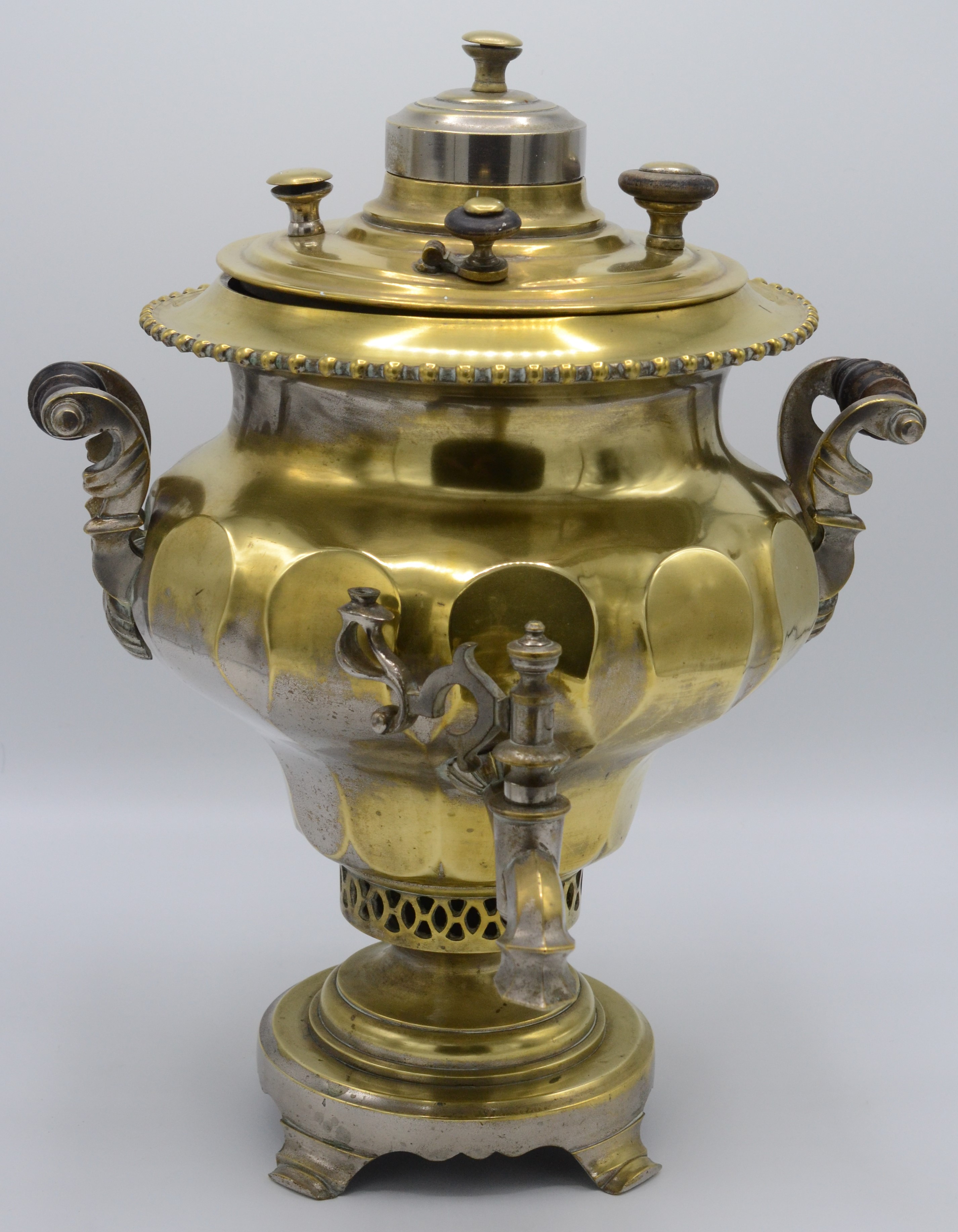 A Russian brass samovar, with maker's mark to cover and turned wood ...