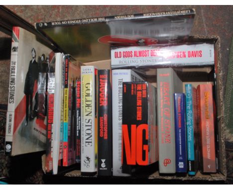 A box of Rolling Stones related books including "Old Gods Almost Dead" by Stephen Davis.