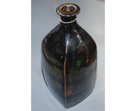 A large Trevor Corser, Leach Pottery bottle vase, the square section body with tenmoku glaze height 45.5cm.