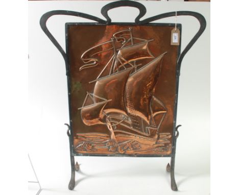 An Arts and Crafts Hayle Copper and wrought iron firescreen, the rectangular panel embossed with a galleon under way, the iro