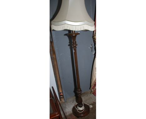 A carved standard lamp.