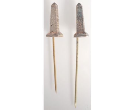 Two Cleopatra needle silver finial pins, each with Victorian registration mark.